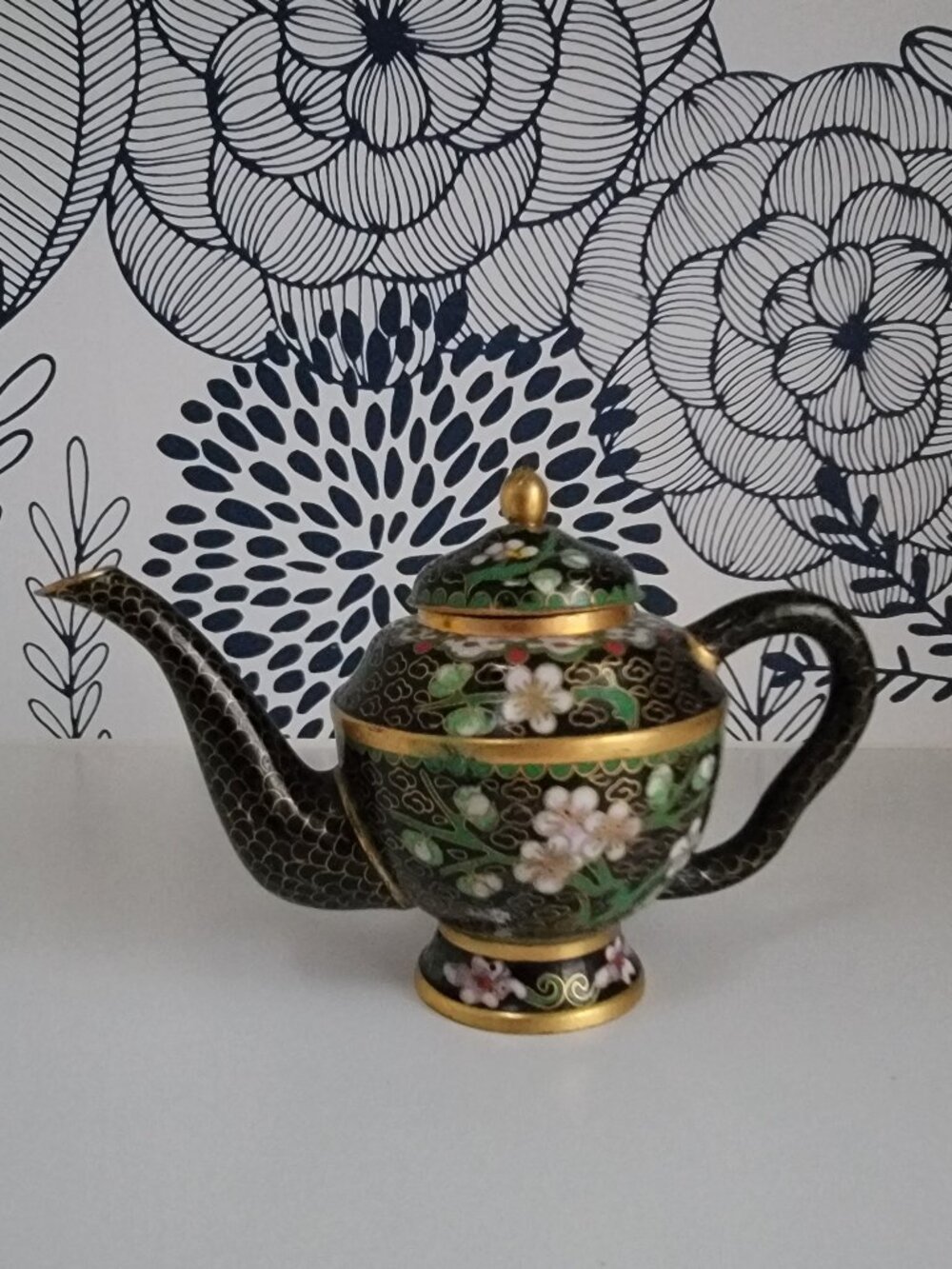 Miniature cloisonne teapot, black with gold, green stems, white flowers GUC